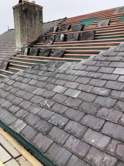 Pitched roof stripped back to battens during tile roof replacement